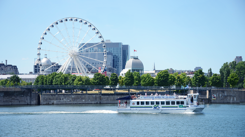 The river shuttle on the St. Lawrence with Montreal's Ferris wheel in the background.